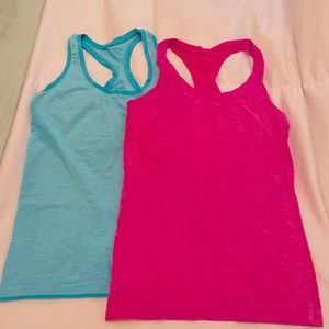 Two VSX athletic tanks! Super comfy, stretchy fabric, moisture wicking!